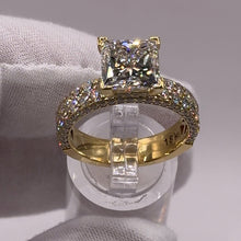 Load image into Gallery viewer, Princess diamond pavé ring on a stand, three-quarter view