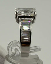 Load image into Gallery viewer, Side profile of the radiant diamond ring showing the basket and baguette channel