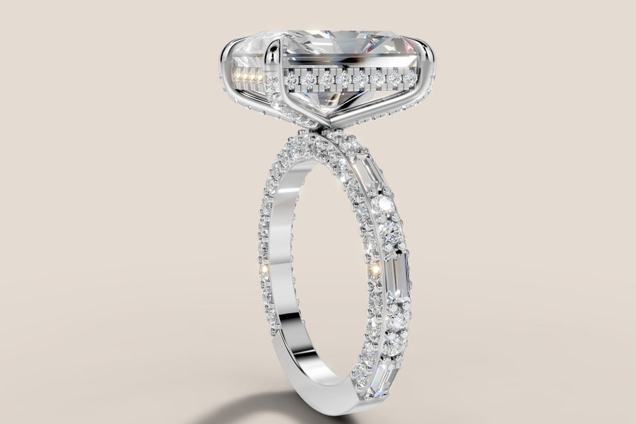 Radiant lab diamond engagement ring with hidden halo and three-sided pave shank of round brilliants and baguettes in 14k white gold, low three-quarter view