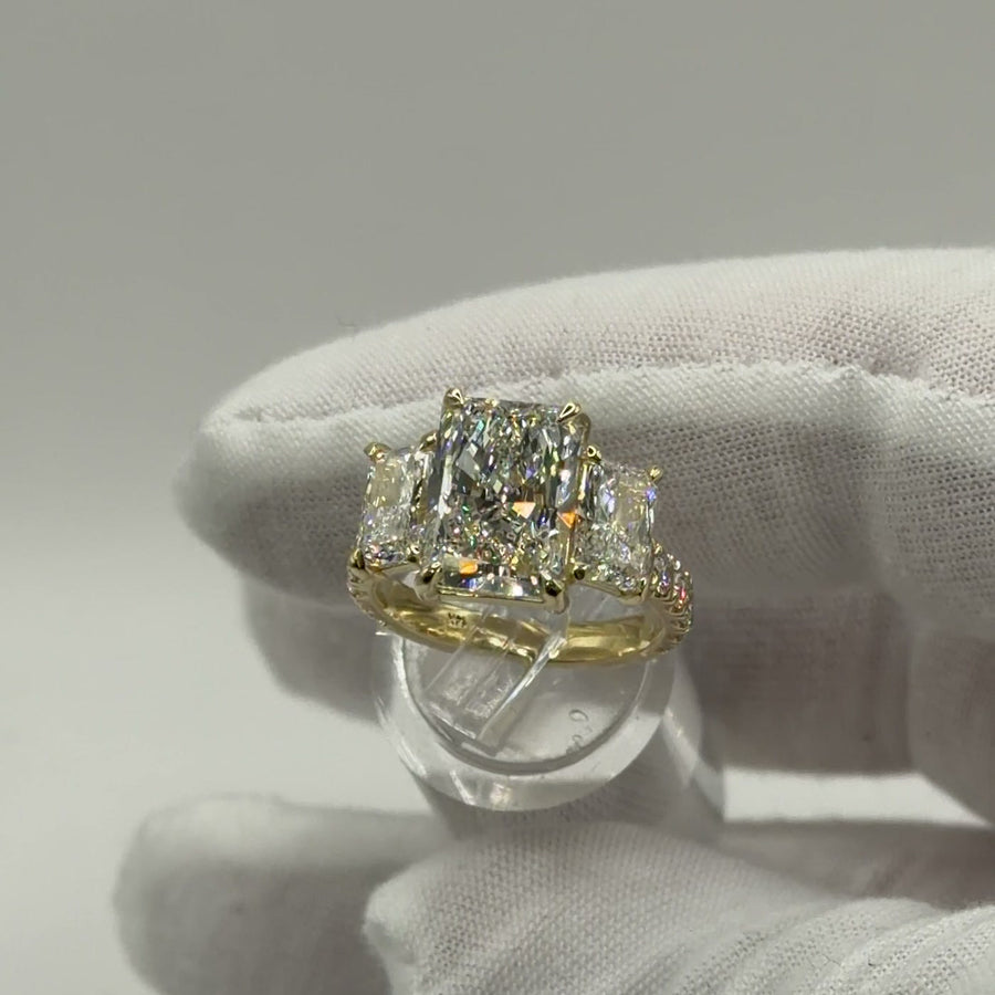 Three-stone radiant diamond engagement ring in 14k yellow gold, front view