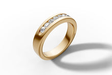 Load image into Gallery viewer, Standing three-quarter view of the 14k gold channel-set diamond wedding band