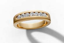 Load image into Gallery viewer, Channel-set diamond band in 14k yellow gold, angled view showing seven round brilliant lab diamonds set flush in the channel