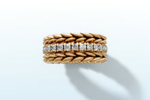 Load image into Gallery viewer, Top view of the 14k yellow gold ring set showing the diamond band nested between two braided wheat bands