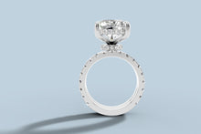 Load image into Gallery viewer, Front view of radiant lab diamond engagement ring set showing the hidden halo collar under the basket and round brilliants running fully around the band in 14k white gold
