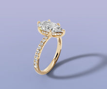 Load image into Gallery viewer, Pear lab diamond engagement ring with hidden halo and single-row pave shank in 14k yellow gold, three-quarter view