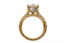 Load image into Gallery viewer, Side view of carved floral shank with round brilliant pave row beneath the pear-cut center, 14k yellow gold