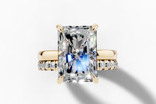 Load image into Gallery viewer, Top view of the elongated radiant-cut lab diamond with claw prongs in 14k yellow gold