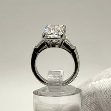 Load image into Gallery viewer, Cushion diamond ring seen through the band, both baguettes visible
