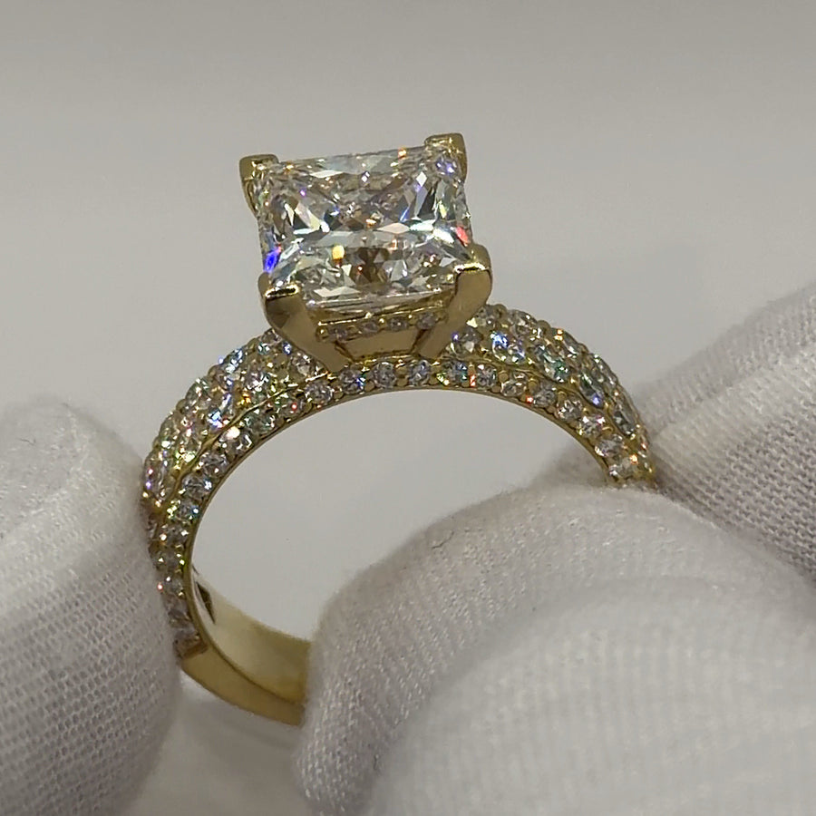 Princess-cut lab diamond ring with three-row pavé band in yellow gold, three-quarter view