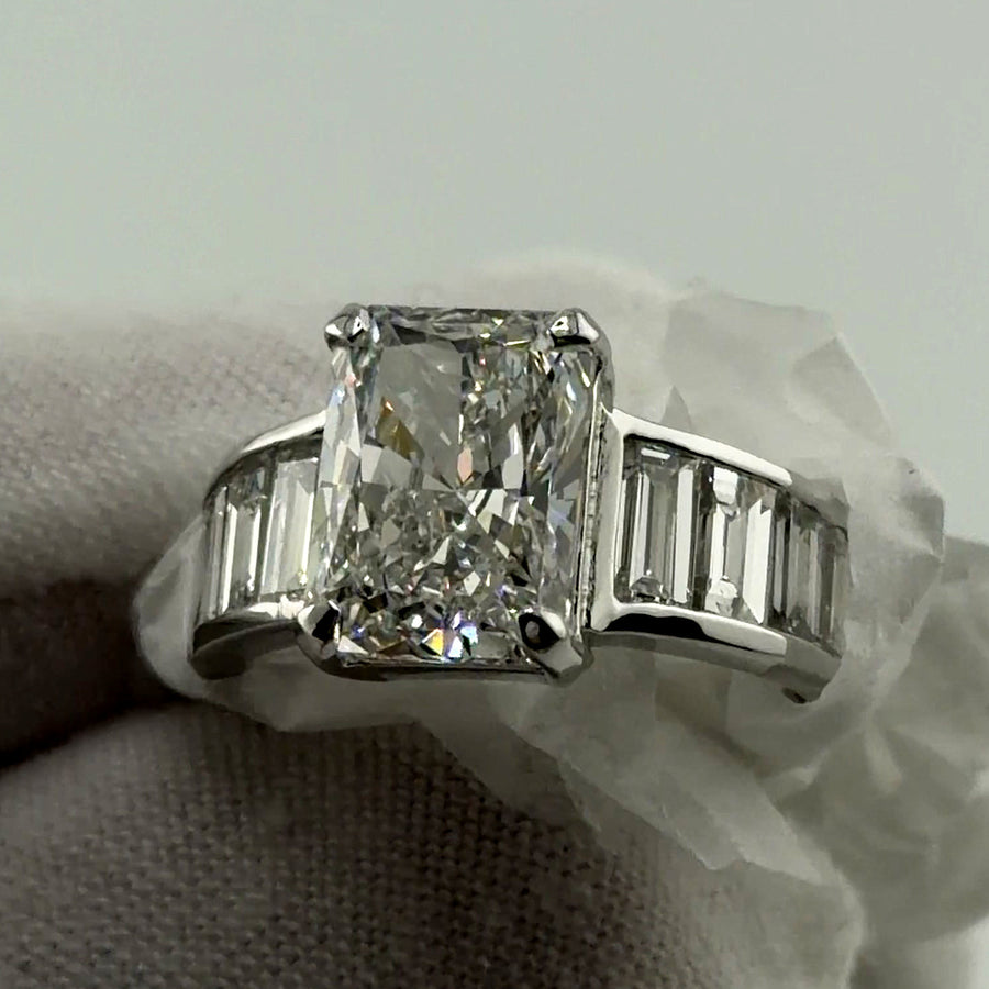 Radiant lab diamond ring with channel-set baguette band in 14k white gold, front three-quarter view