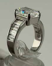 Load image into Gallery viewer, Radiant diamond ring with channel-set baguettes on a wide 14k white gold band
