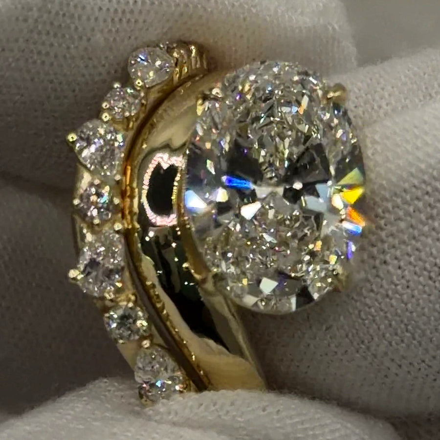 East-west oval lab diamond ring with matching pear and round contour band in 14k yellow gold