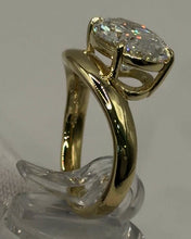 Load image into Gallery viewer, Side profile of the oval bypass engagement ring
