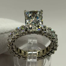Load image into Gallery viewer, Radiant lab diamond ring with emerald-cut eternity band in 14k white gold, front three-quarter view
