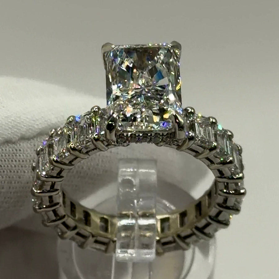 Radiant lab diamond ring with emerald-cut eternity band in 14k white gold, front three-quarter view