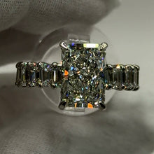 Load image into Gallery viewer, Radiant diamond ring with emerald-cut band, top view
