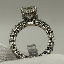 Load image into Gallery viewer, Emerald-cut diamonds all the way around the band, front view through the ring
