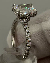 Load image into Gallery viewer, Radiant diamond ring with hidden halo and prong-set band, side three-quarter view
