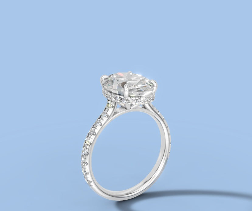 Oval lab diamond engagement ring with hidden halo and single-row pave shank in 14k white gold, three-quarter view