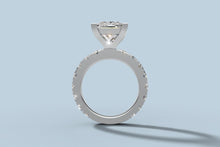 Load image into Gallery viewer, Side profile of princess diamond ring showing the open V basket and round brilliants shared-prong set around the full band
