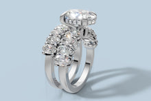 Load image into Gallery viewer, Angled view of the oval diamond bridal set with the engagement ring and matching oval band seated together in 14k white gold
