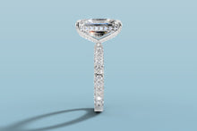 Load image into Gallery viewer, Side profile of radiant lab diamond ring showing the hidden halo of round brilliants beneath the basket and the pavé rows running down both sides of the band

