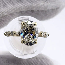 Load image into Gallery viewer, 2.52 carat oval diamond ring with marquise and round diamond band, top view
