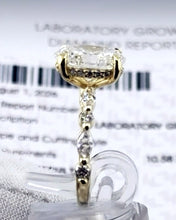 Load image into Gallery viewer, Oval diamond ring in front of its IGI lab-grown diamond report
