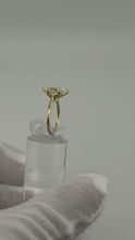 Load image into Gallery viewer, Side profile of a marquise-cut lab diamond solitaire in a 14k yellow gold cathedral setting
