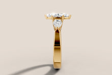 Load image into Gallery viewer, Side profile of marquise diamond ring showing pear accent and knife-edge band in 14k yellow gold
