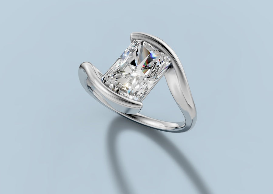 Radiant-cut lab diamond engagement ring in a half-bezel bypass setting with a slim rounded shank in 14k white gold, three-quarter view