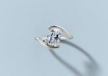 Load image into Gallery viewer, Elevated angle of radiant diamond bypass engagement ring with the split shank sweeping past the center stone in 14k white gold
