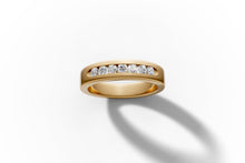 Load image into Gallery viewer, Front view of the flat-profile 14k gold band with channel-set round diamonds
