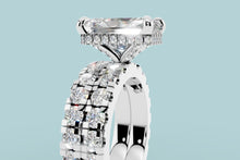 Load image into Gallery viewer, Close-up of the hidden halo of round brilliants and the twin pave bands on the radiant diamond ring
