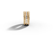Load image into Gallery viewer, Standing profile view of 14k yellow gold twisted rope and pave diamond band
