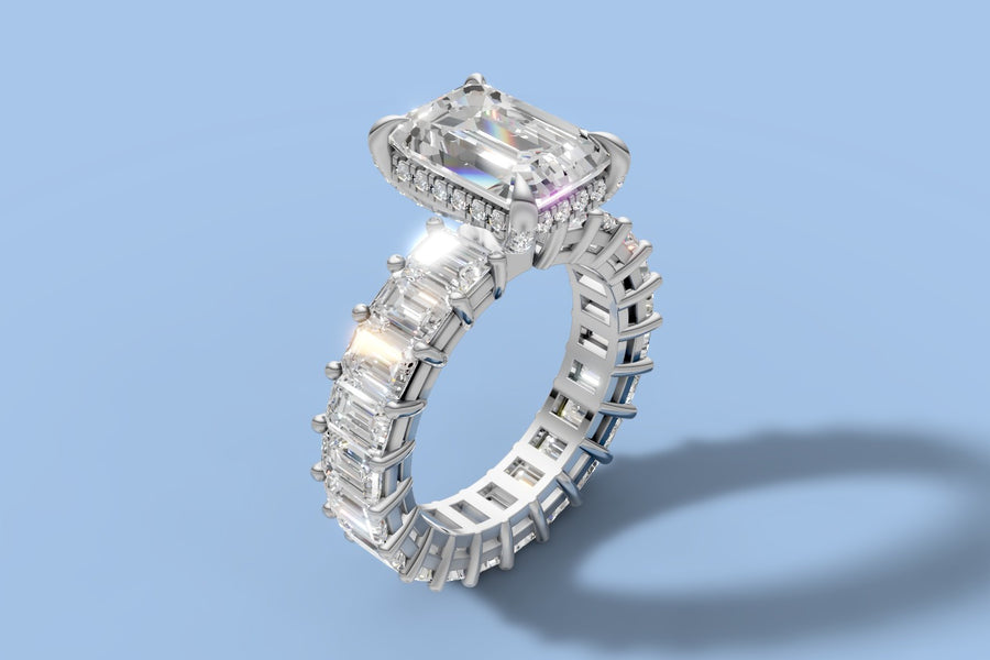 Emerald-cut lab diamond engagement ring with hidden halo and full eternity band of emerald-cut diamonds in 14k white gold, three-quarter view