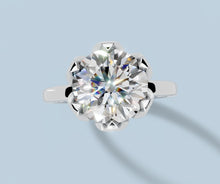 Load image into Gallery viewer, Top view of round lab diamond tulip solitaire ring showing the six petal prongs framing the center stone in 14k white gold
