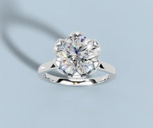 Load image into Gallery viewer, Angled top view of round lab diamond solitaire ring with tulip setting and rounded shank in 14k white gold
