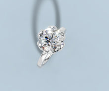 Load image into Gallery viewer, Tilted view of round lab diamond tulip solitaire engagement ring in 14k white gold
