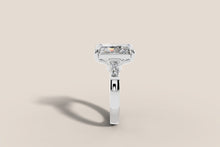 Load image into Gallery viewer, Radiant-cut diamond ring with tapered baguette side stones in 14k white gold, profile view
