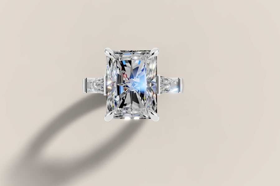 Radiant-cut lab diamond ring with tapered baguette side stones in 14k white gold, face-up view
