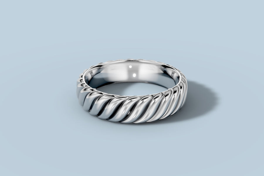 Twisted rope band in 14k white gold with fully rounded spiral ridges and a polished comfort-fit interior, low-angle view