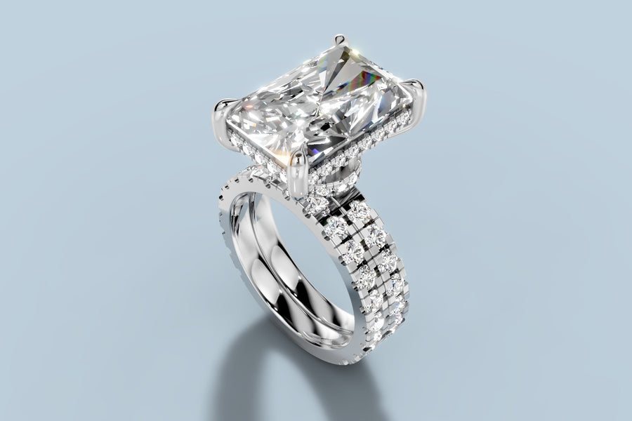 Radiant-cut lab diamond engagement ring with hidden halo basket and matching eternity band in 14k white gold, three-quarter view