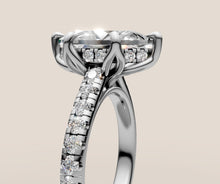 Load image into Gallery viewer, Close-up of marquise solitaire basket and pave band detail in 14k gold
