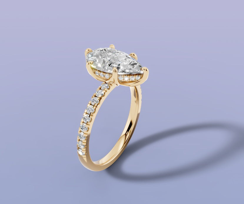 Pear lab diamond engagement ring with hidden halo and single-row pave shank in 14k yellow gold, three-quarter view