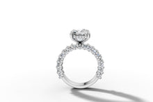 Load image into Gallery viewer, Upright profile view showing the hidden halo of pave beneath the radiant-cut center
