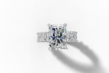 Load image into Gallery viewer, Top view of the radiant-cut center diamond over the cluster pave band
