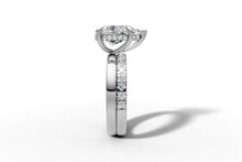 Load image into Gallery viewer, Side profile of pear diamond ring showing claw prongs, hidden halo and stacked double shank in 14k white gold
