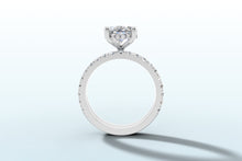 Load image into Gallery viewer, Side profile of oval diamond ring revealing the hidden halo of round brilliants beneath the basket
