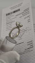 Load image into Gallery viewer, Round diamond hidden halo ring displayed with its lab-grown diamond report
